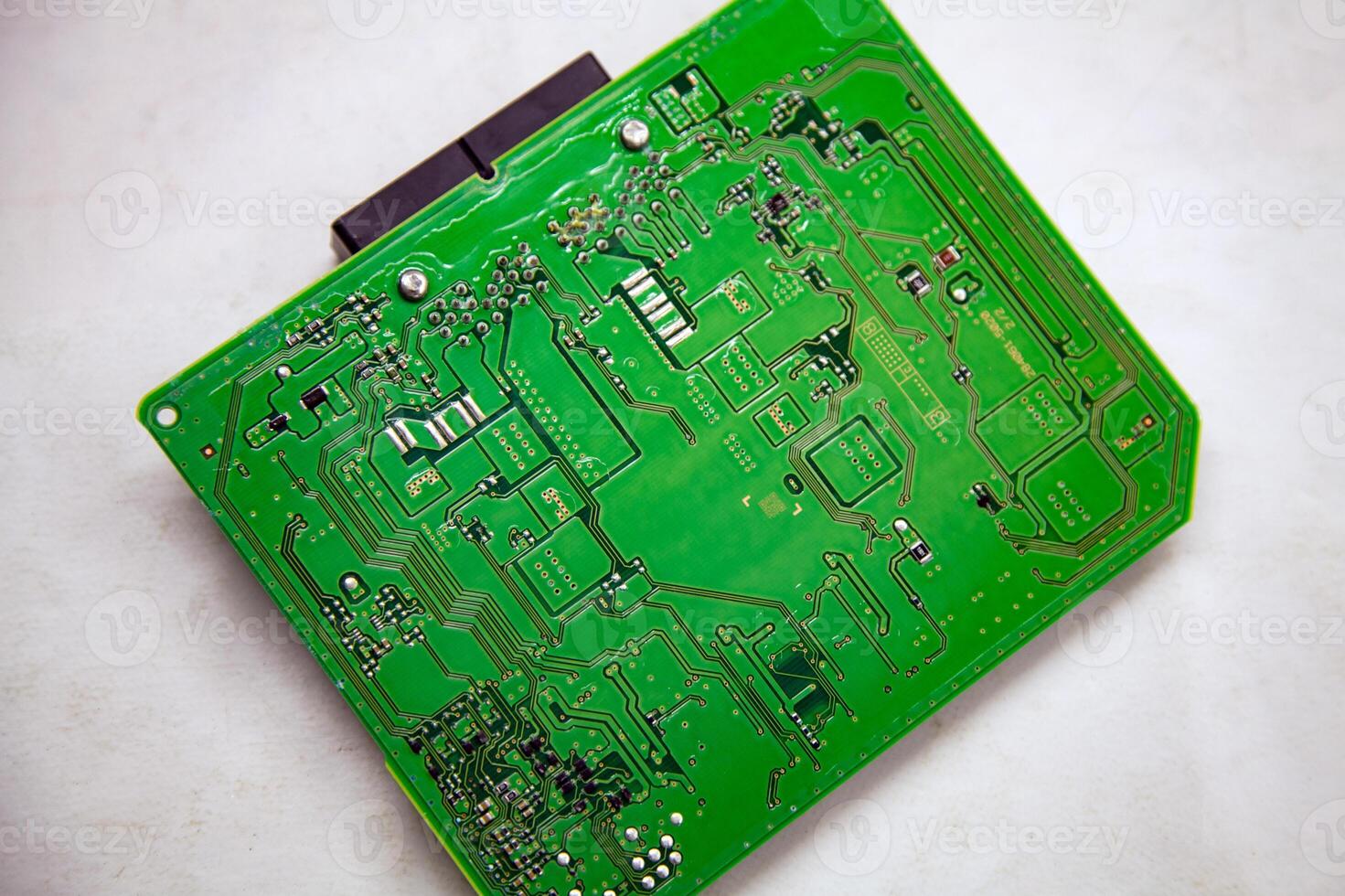 Printed circuit board with microchips and chips from a car safety module photo