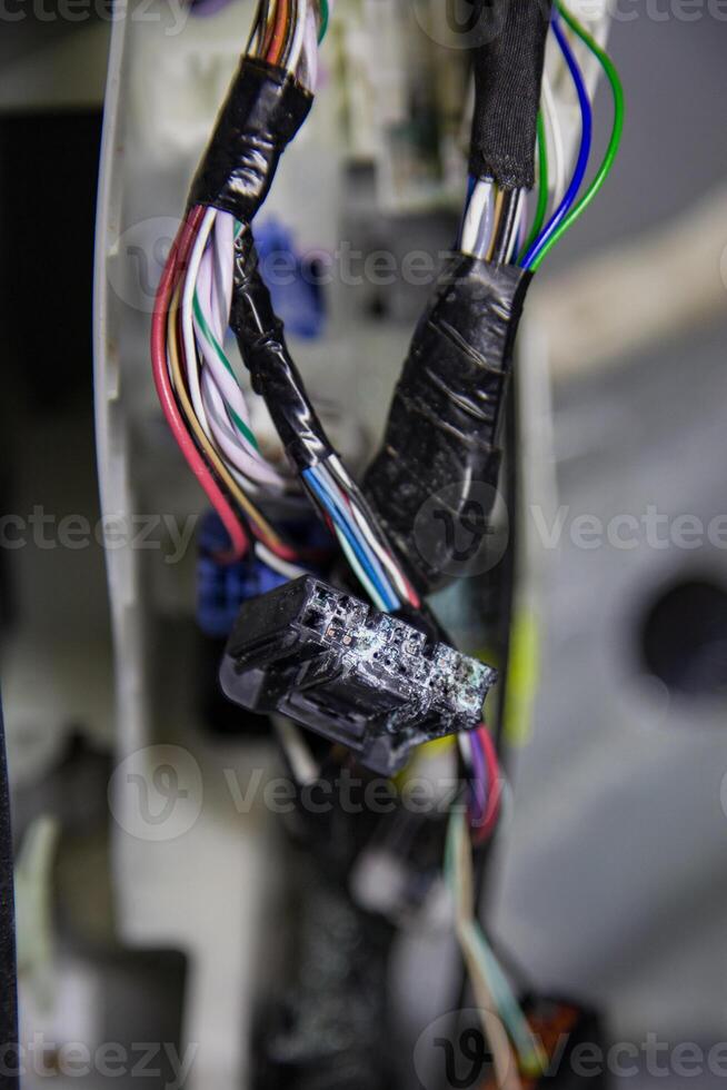 Damaged, oxidized car wiring connectors inside the vehicle after flooding with saltwater photo