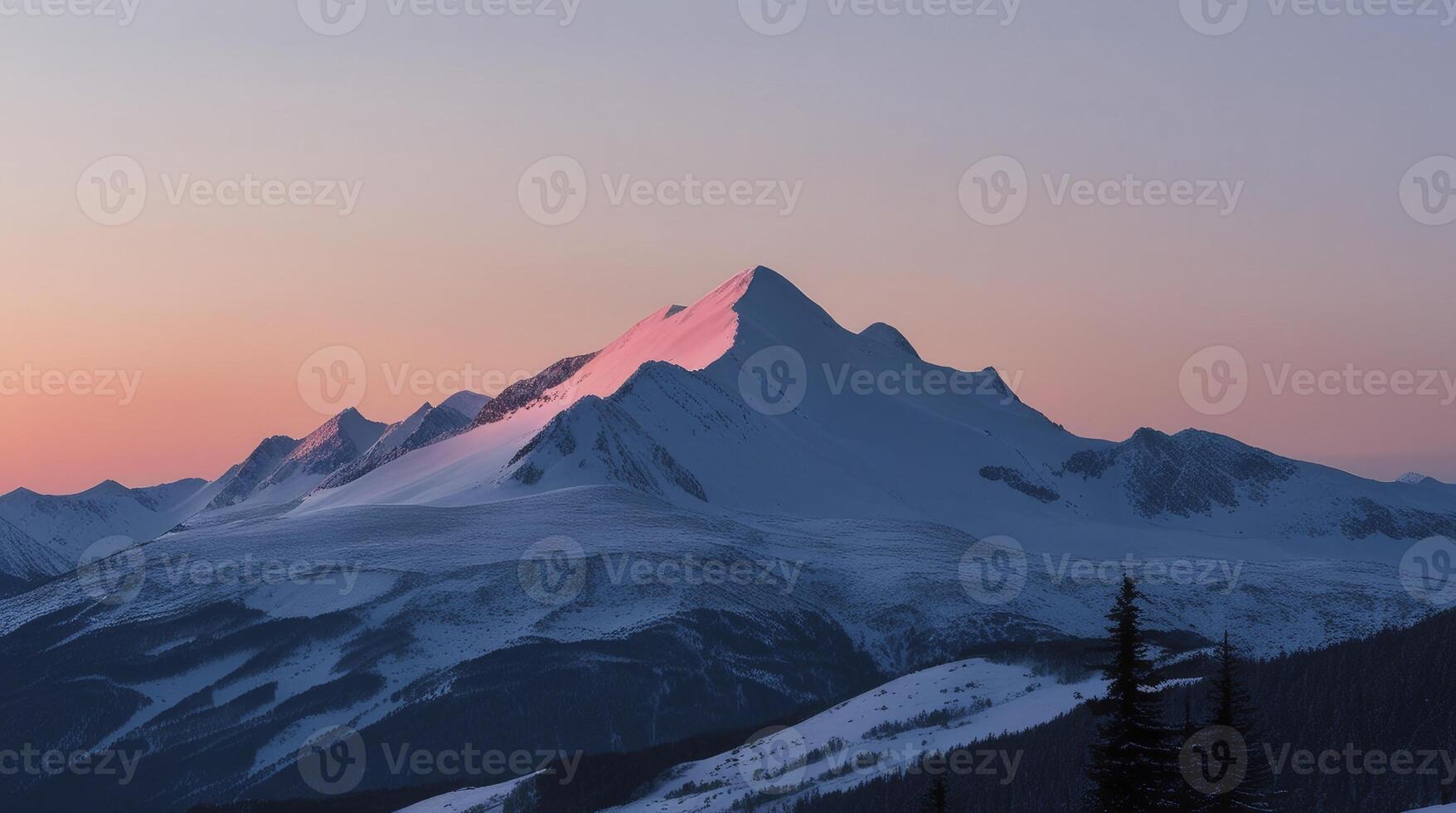 Snowy Mountain Peak Illuminated at Sunset with a Calm Sky photo