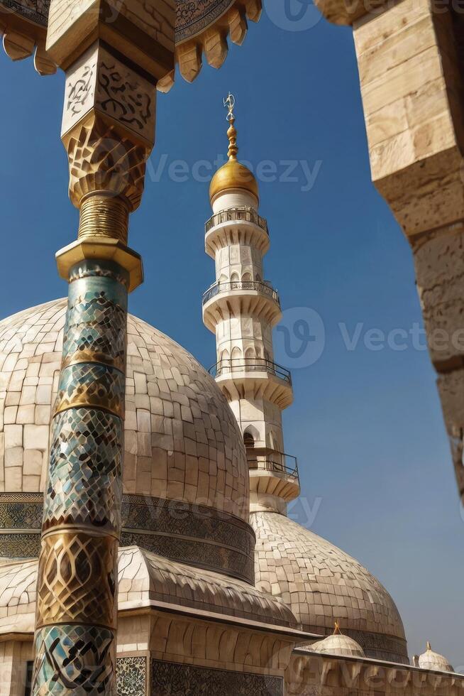 Viewing Mosque Domes and Minaret Through Ornate Archway on Clear Day photo