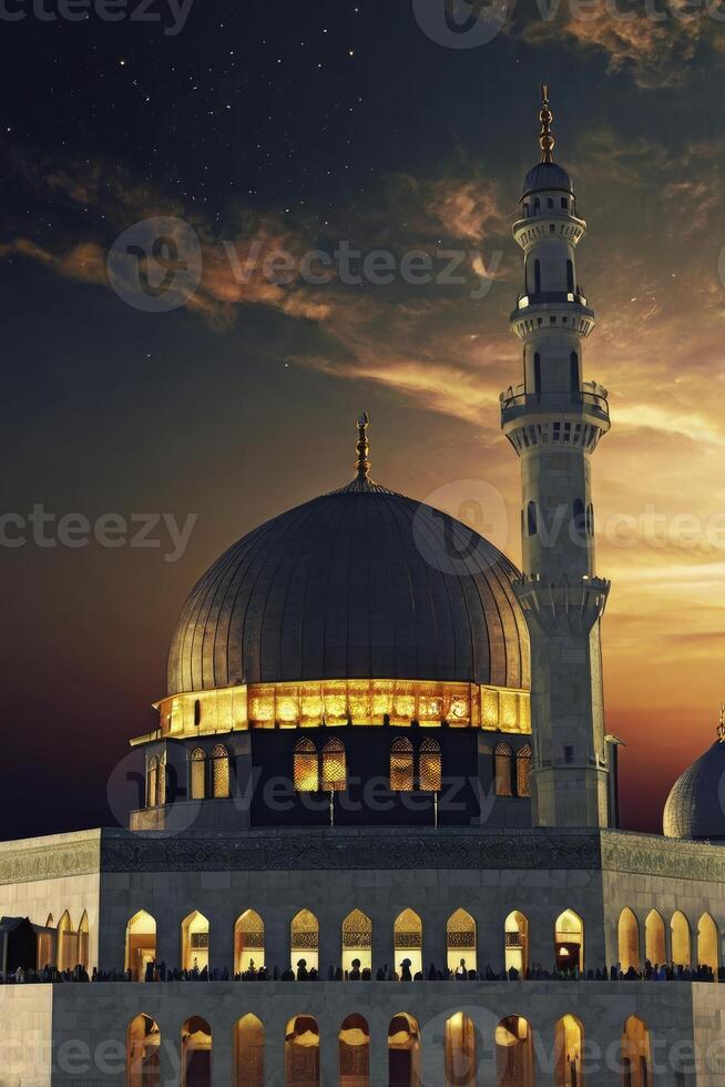 Dramatic Mosque at Night with Tower and Golden Light at Dusk photo