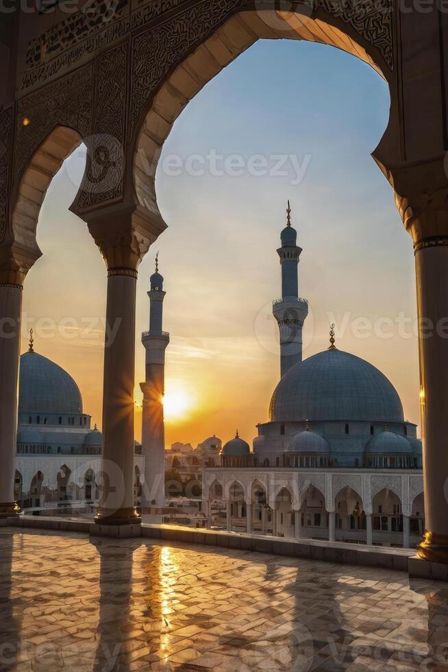 Mosque Architecture at Sunset Framed by Arches with Golden Reflections photo