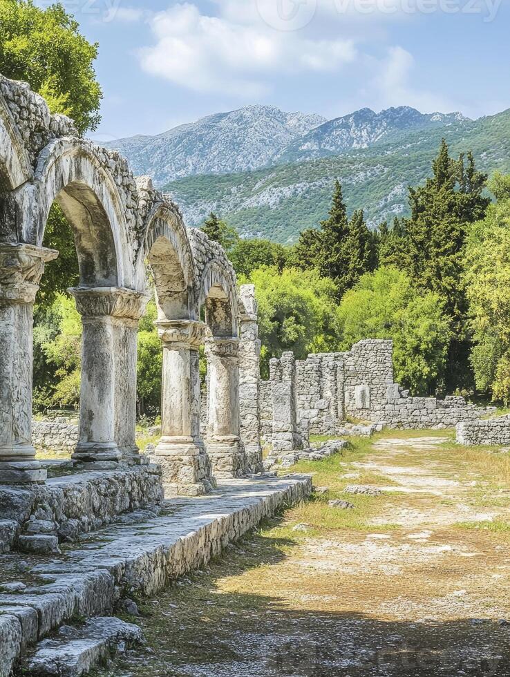 Exploring Ancient Roman Ruins with Arches and Mountains in the Background photo