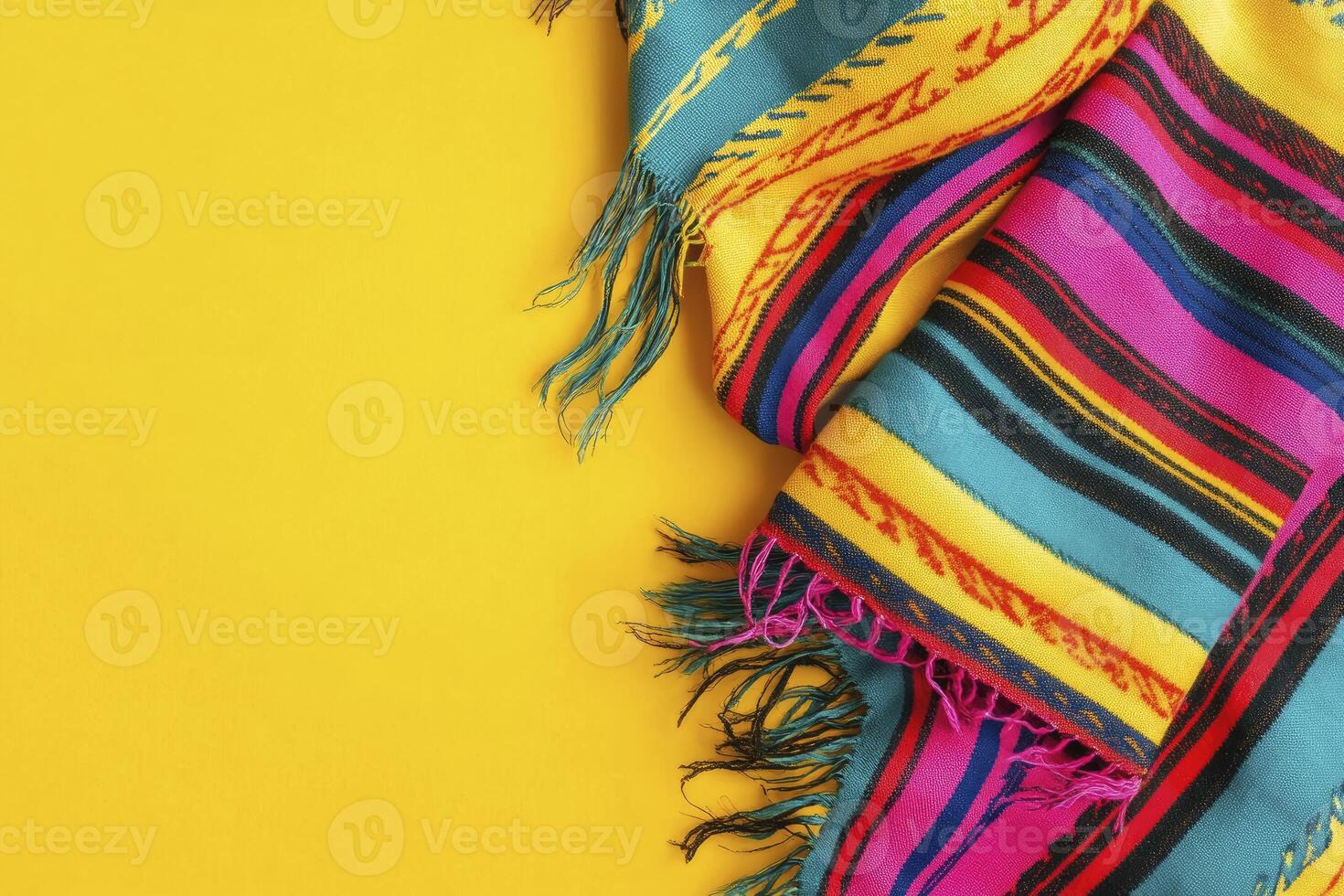 Colorful Striped Blanket with Fringes on Yellow Background for Product Display photo
