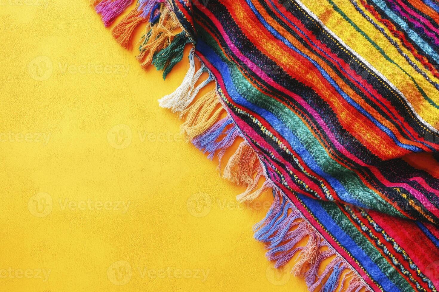 Colorful Striped Textile with Fringe on Yellow Background Texture photo