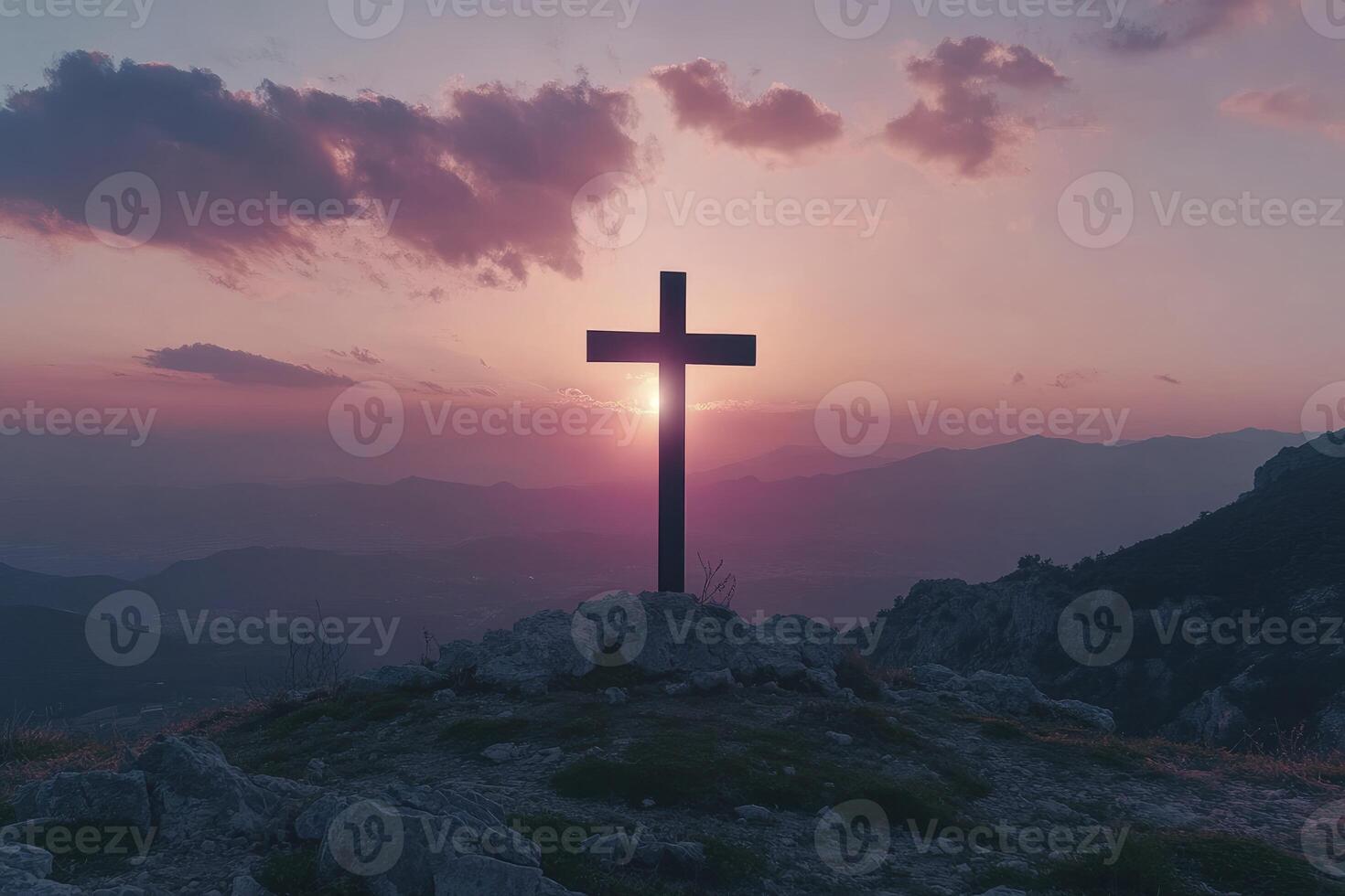 Standing Christian Cross Silhouette on Mountain Peak at Sunset photo
