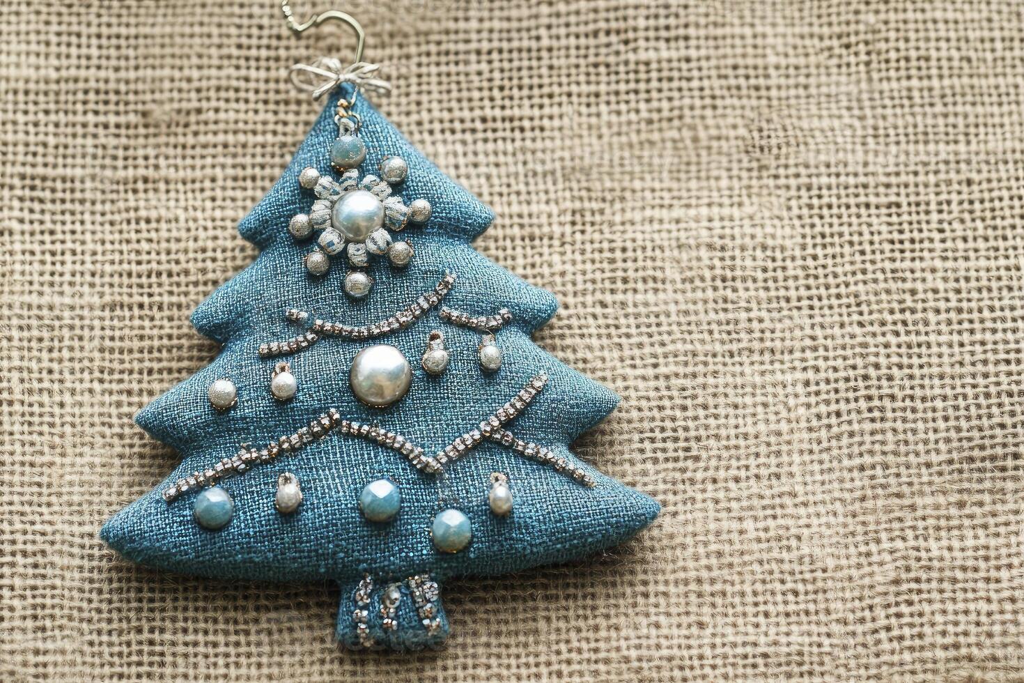 Festive Decorated Christmas Tree Ornament on Burlap Fabric for Holiday Cheer photo