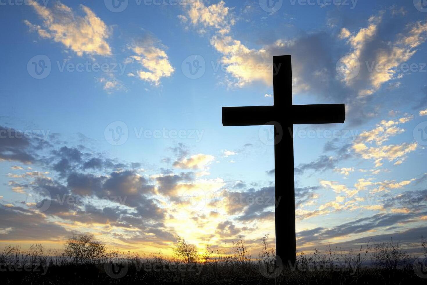 Cross Silhouette Against a Colorful Sky at Sunset Religious Symbol photo