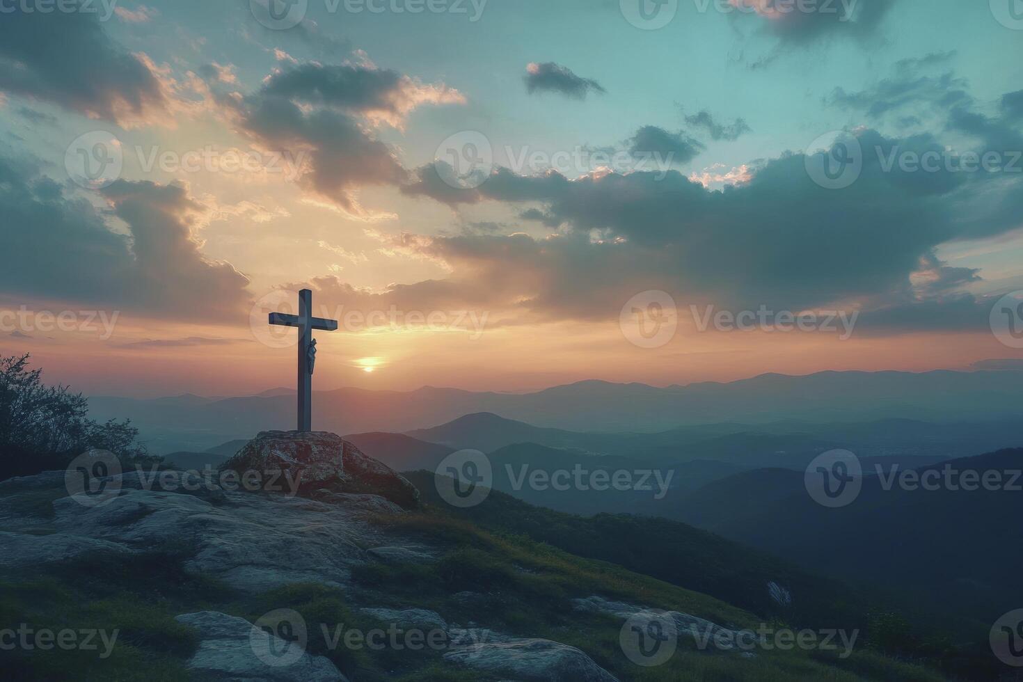 Christian Cross on Mountain Peak at Sunset with Scenic Landscape photo