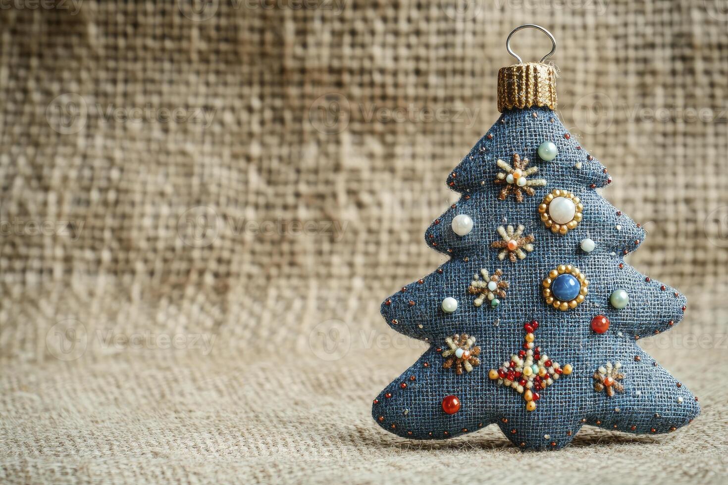 Christmas tree ornament on burlock cloth background photo