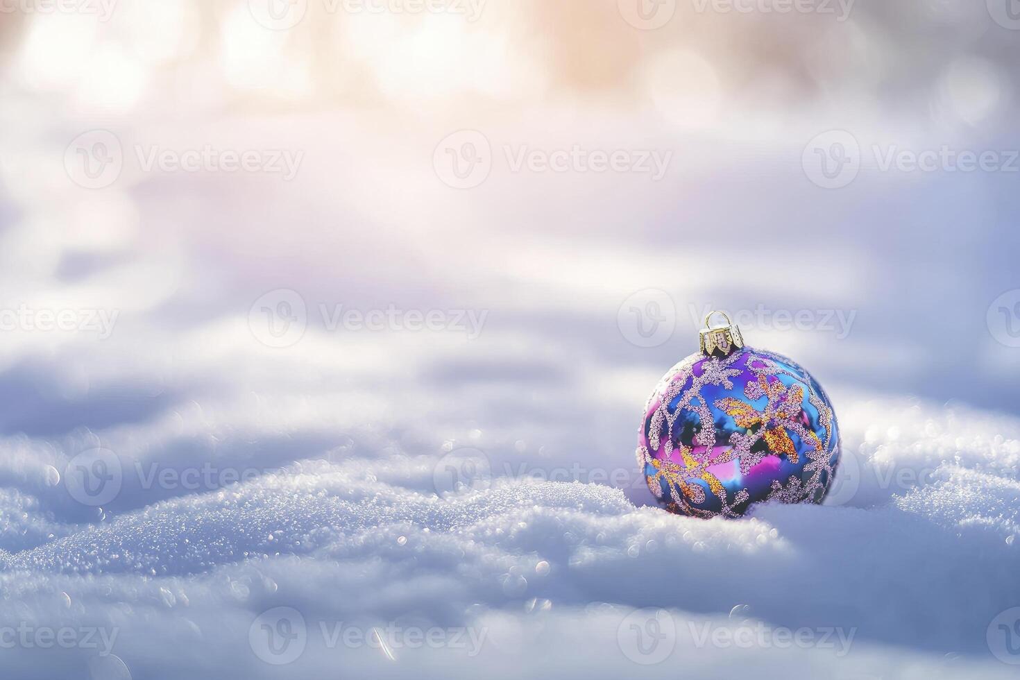 Christmas Ornament Resting in Snow with Bokeh Background for the Holidays photo