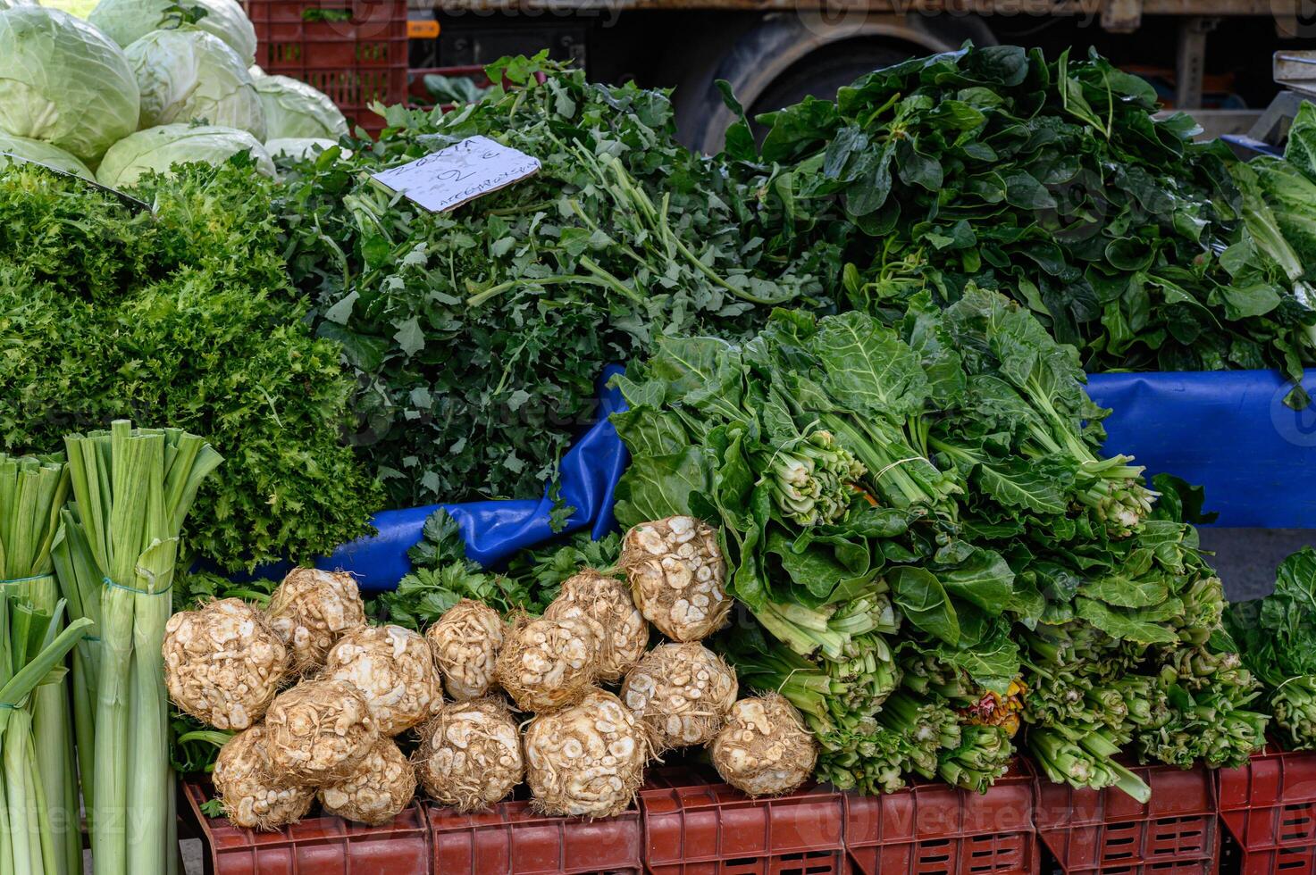 crates overflow with lush, leafy vegetables, creating a rich display of natural freshness. photo