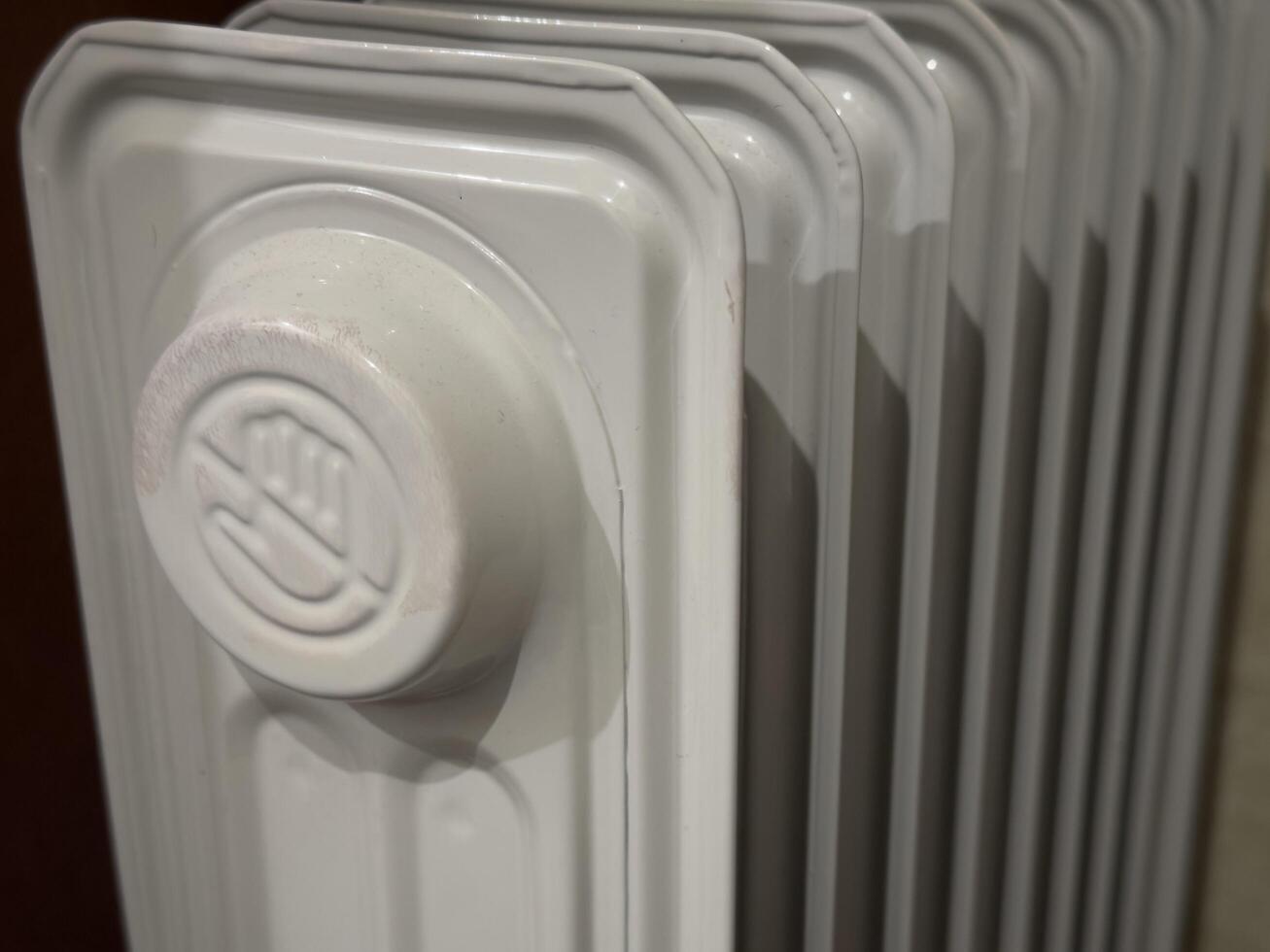 A heater with a symbol warning against touching the hot surface. photo