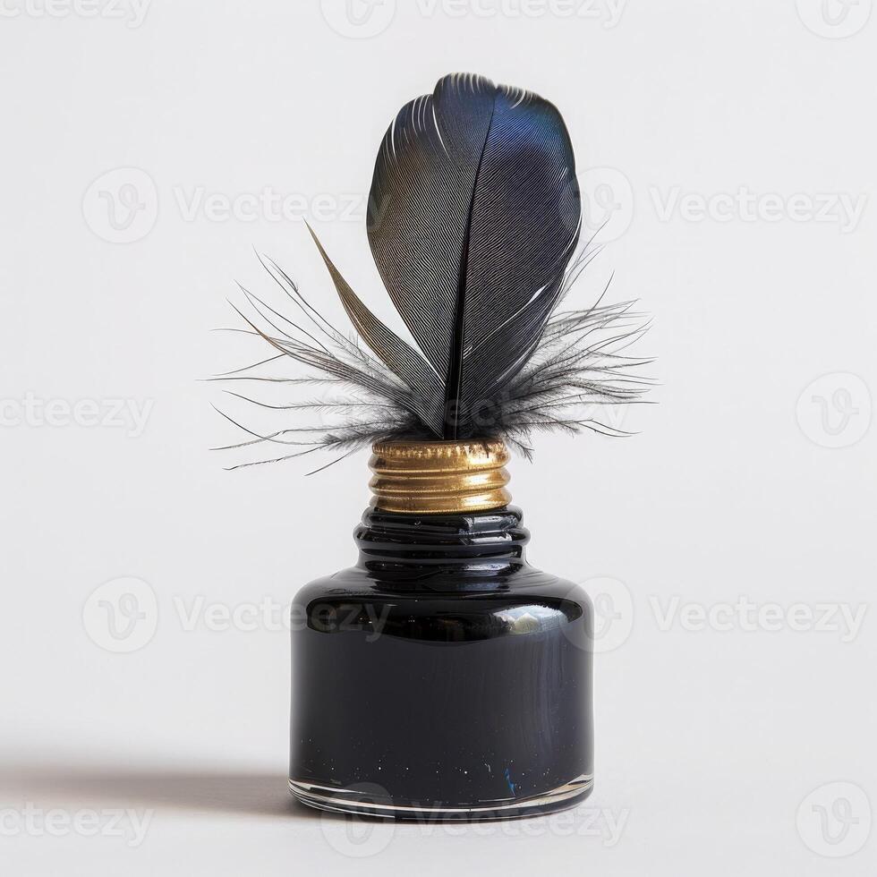 Antique black glass inkwell and blue feather isolated on white background. Symbol of writing, creativity and history. World Poetry Day photo