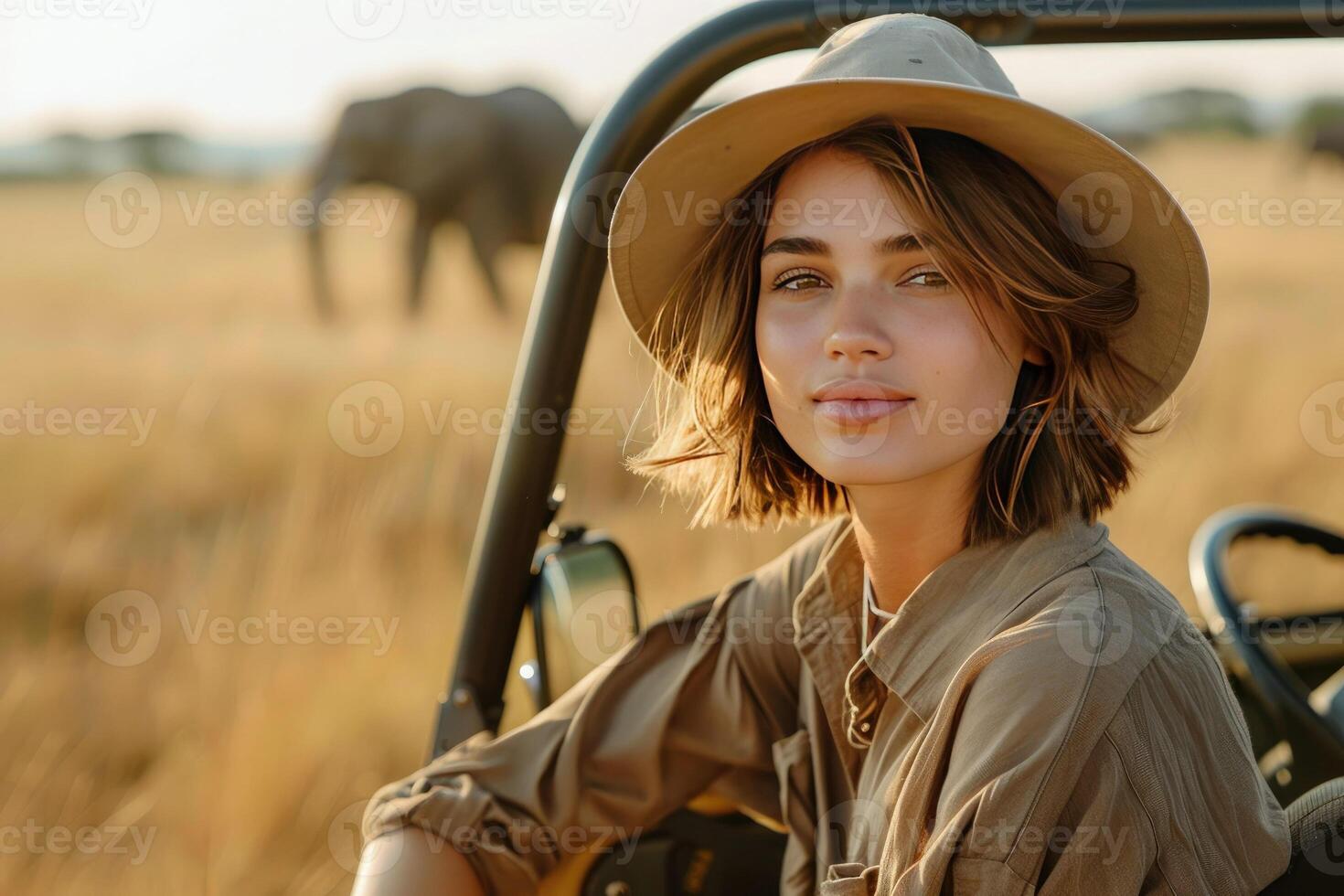 Young beautiful woman in beige linen shirt, safari hat sits in SUV, open top car enjoying African safari, adventure, spirit of freedom photo