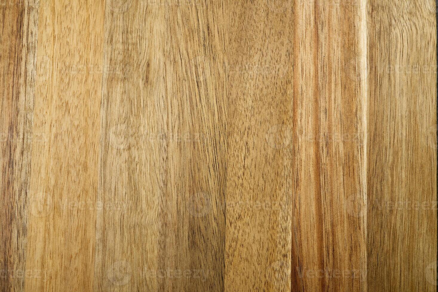 This high-resolution image showcases a rich wood grain texture in warm light brown. It features natural patterns, knots, and striations, perfect for various design applications. photo