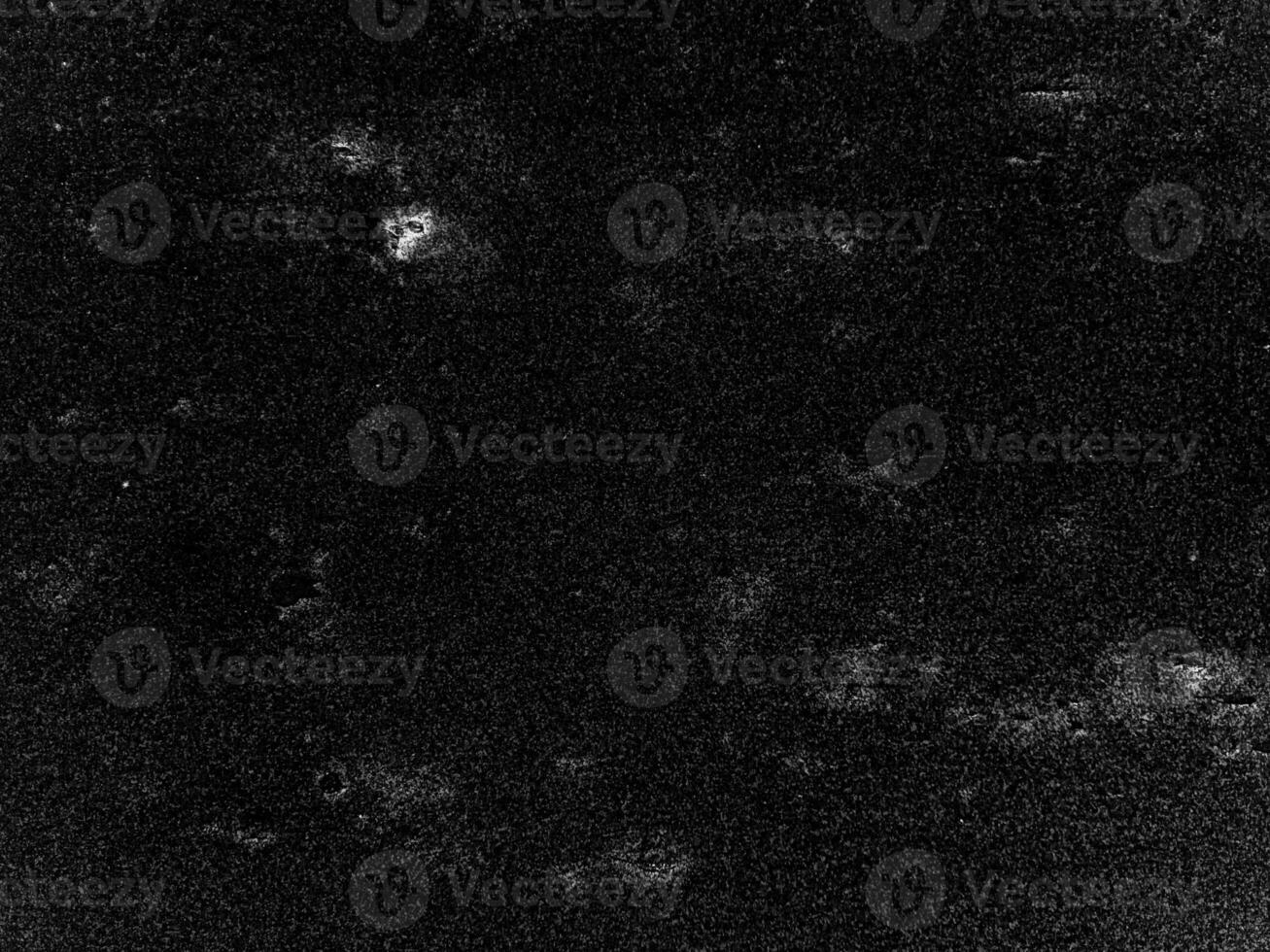 A black and white photo of a black background with a few white specks