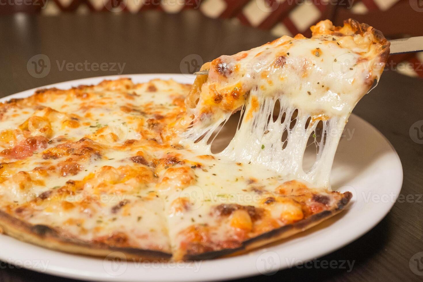 A slice of pizza with cheese on it photo