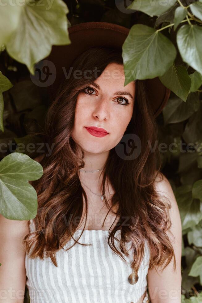 Woman with mysterious glance looking at camera photo