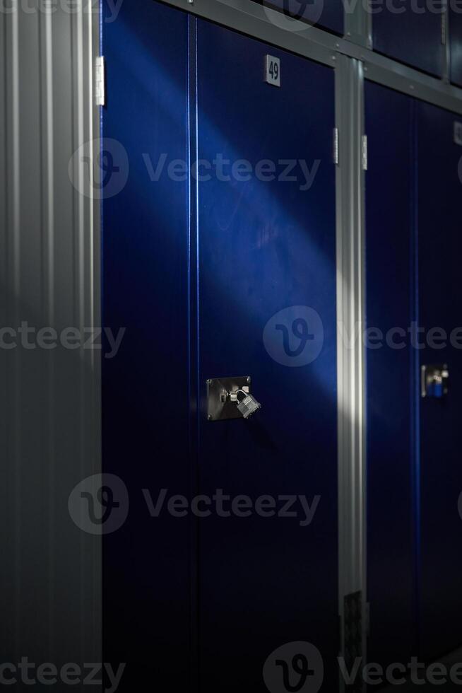 Modern blue lockers in rows in container building photo