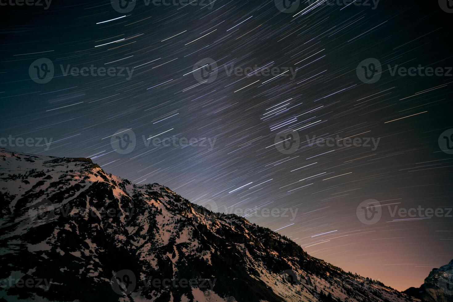 Mountain peak against starry sky photo