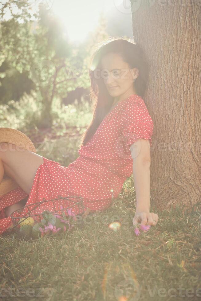 Adult woman in stylish dress on grass photo
