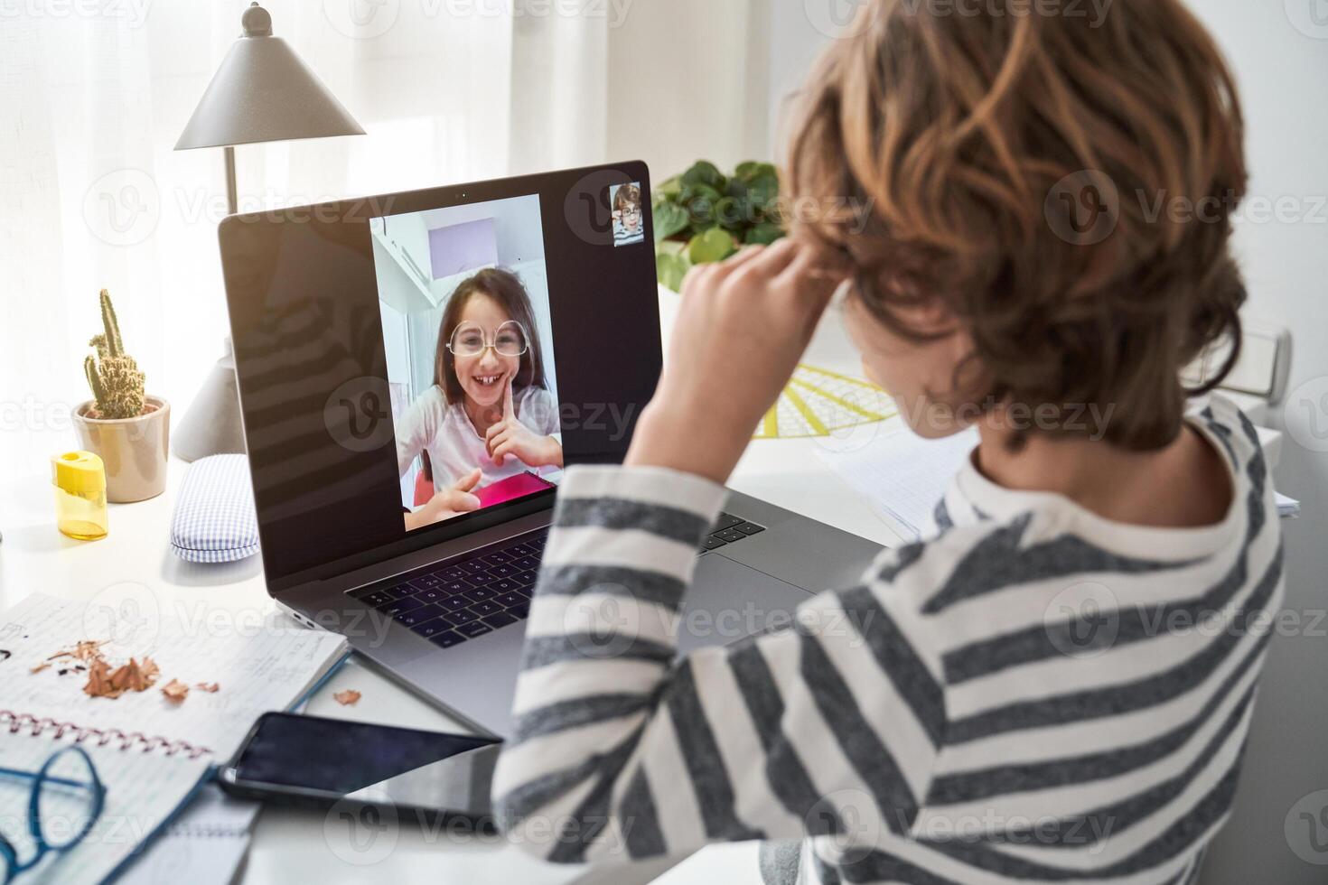 Boy having call with friend photo