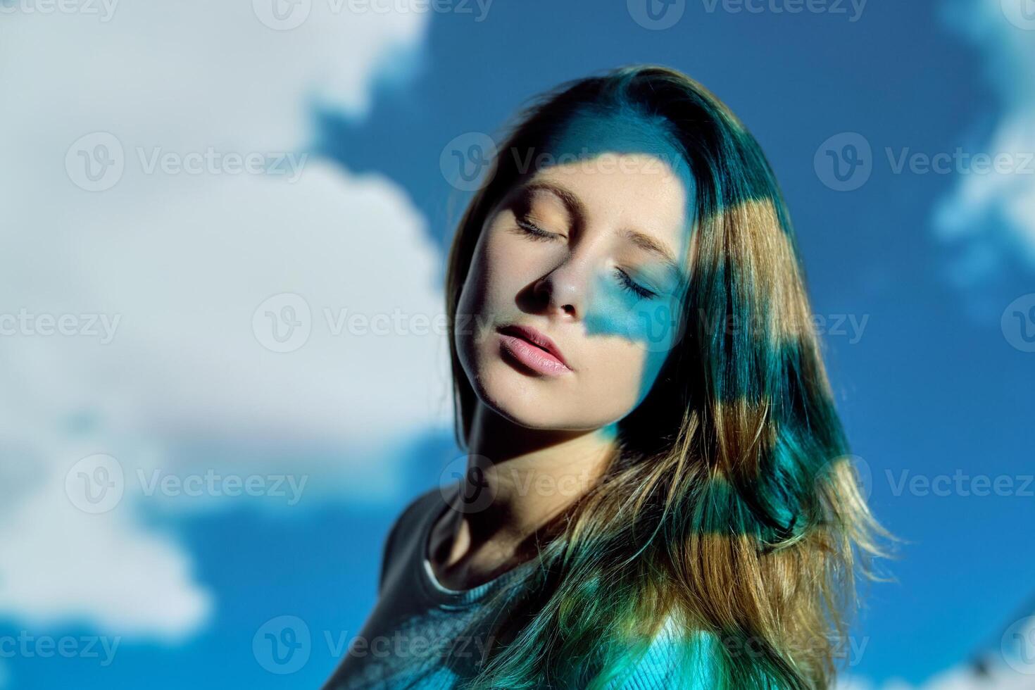 Calm woman against cloudy sky photo