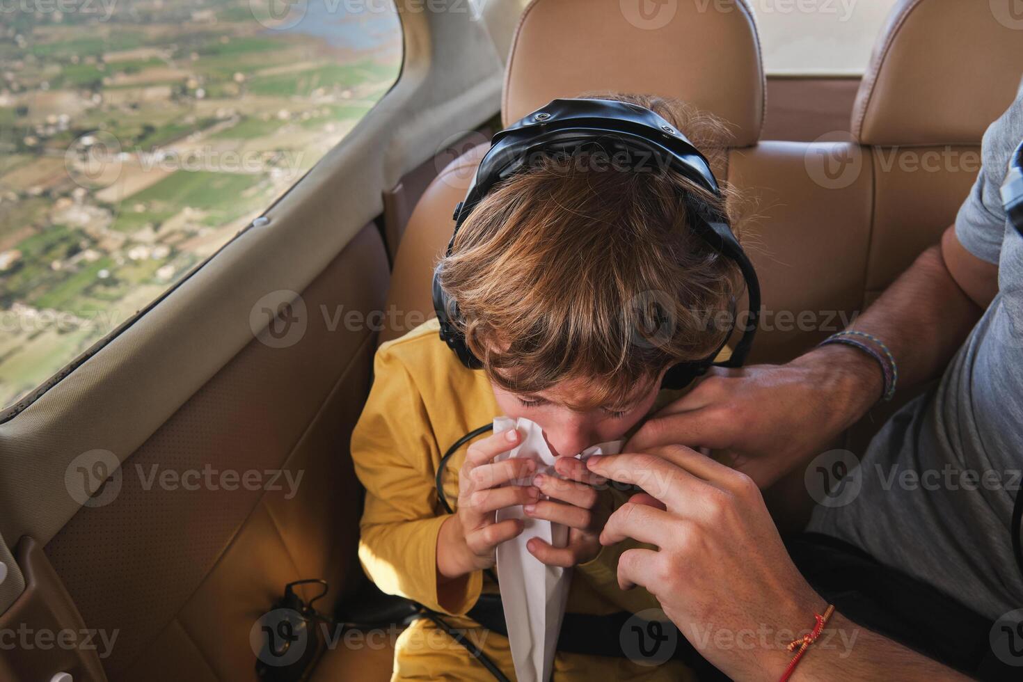 Kid Feeling Dizzy in Plane Ride photo