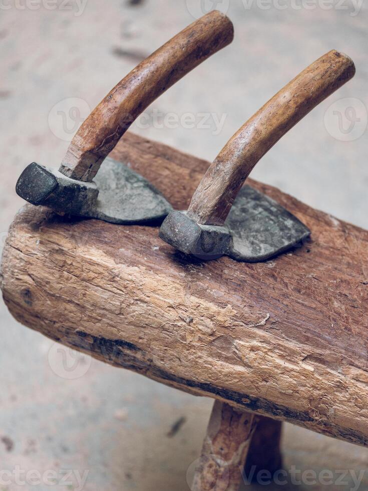 Adze tools on wooden surface photo