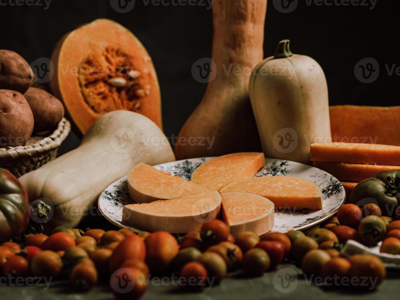 Composition of pumpkin and butternut squash and ripe tomatoes photo