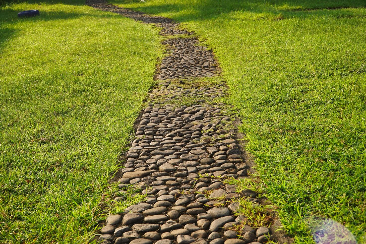 Photo of gravel walkaway path way for walking activities in garden park