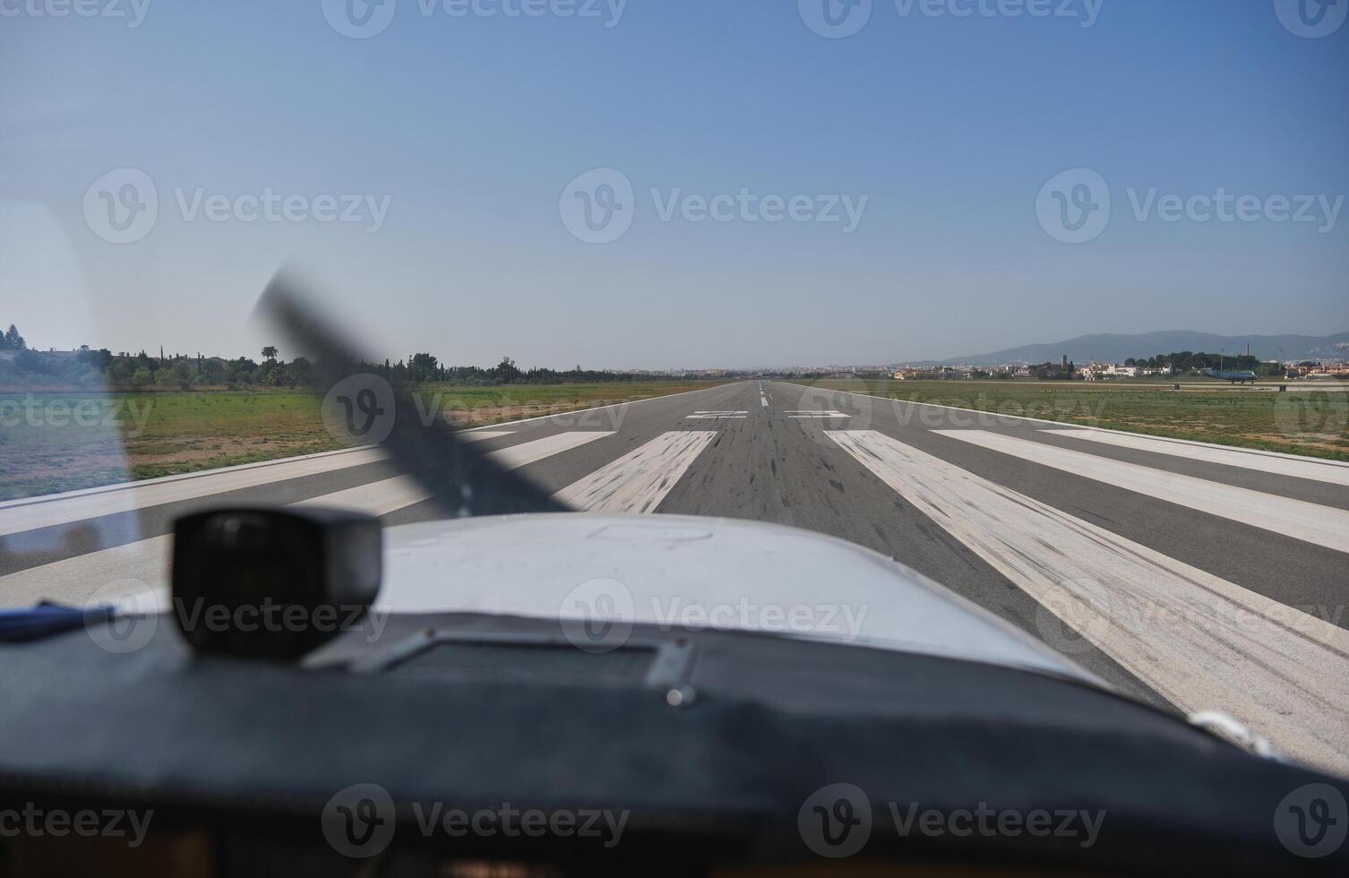 Modern airplane driving along runway under blue sky photo