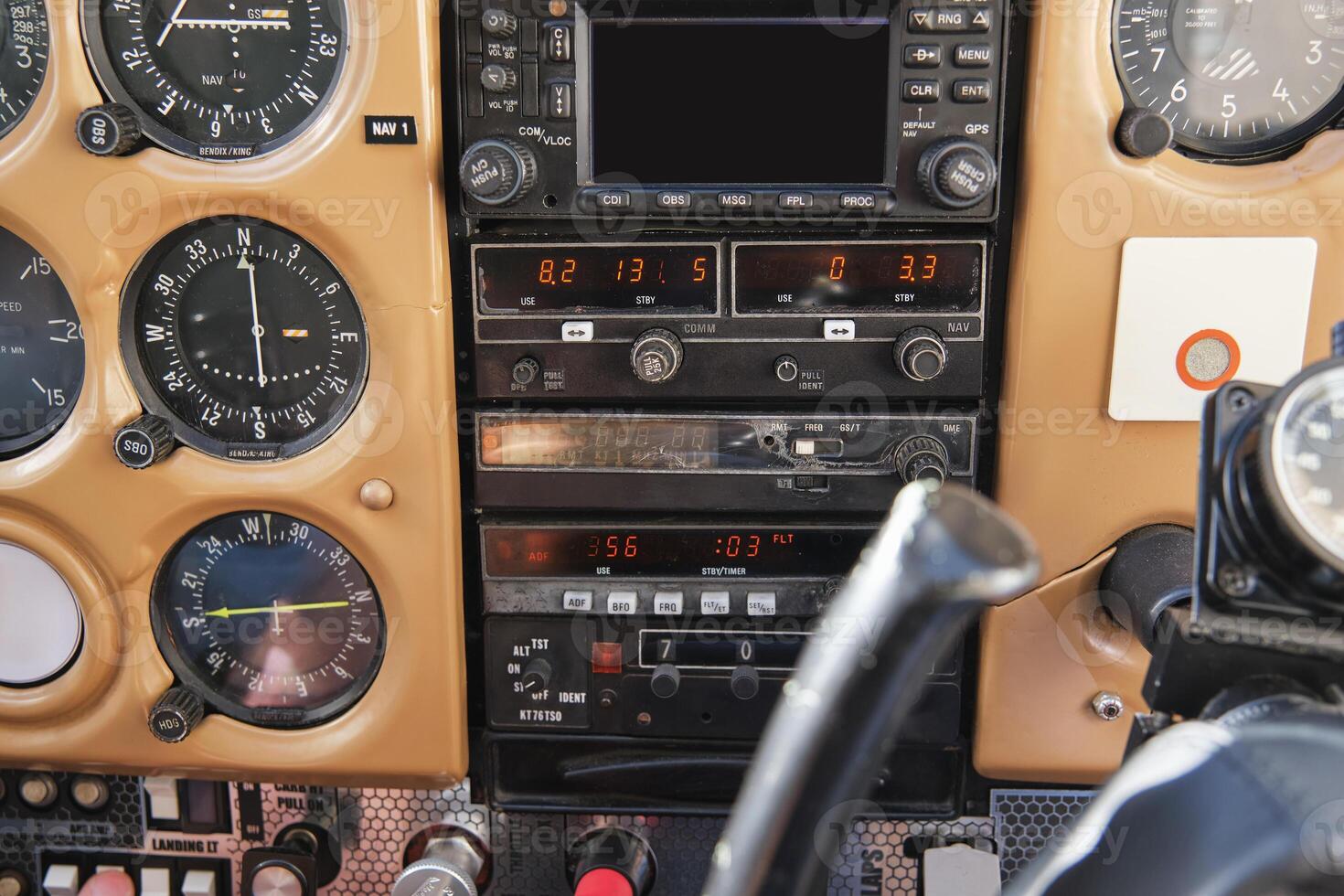 Cockpit control system in airplane in daylight photo