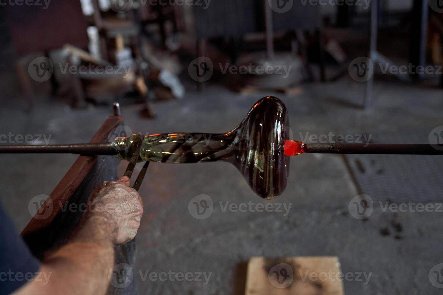 Crop craftsman making hookah base using jacks photo