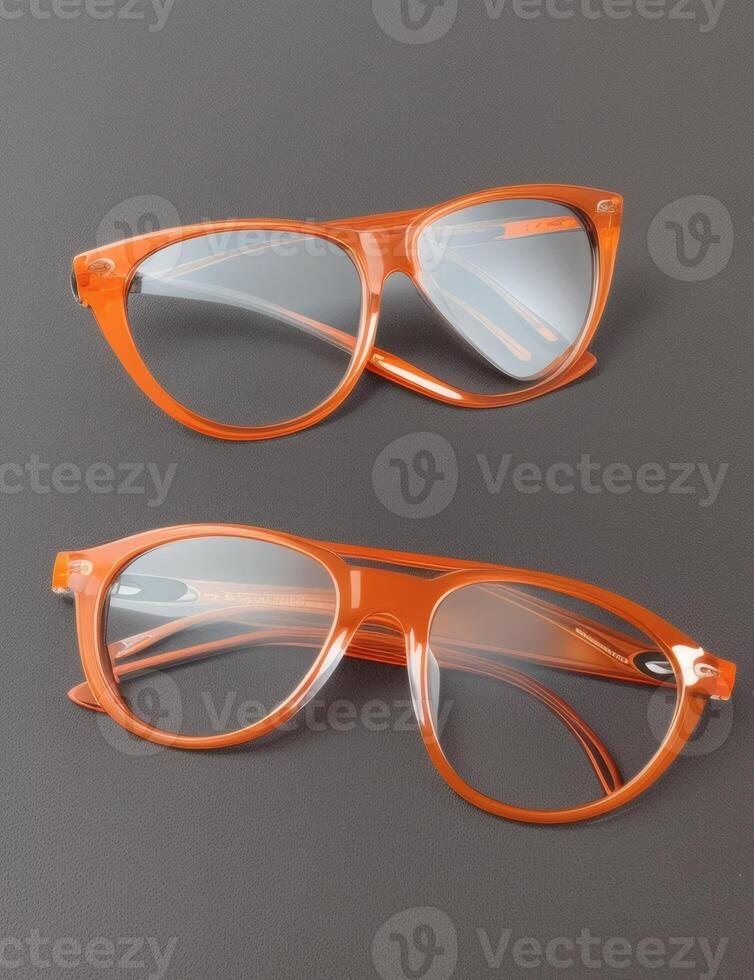 Orange glasses on a dark surface - photo