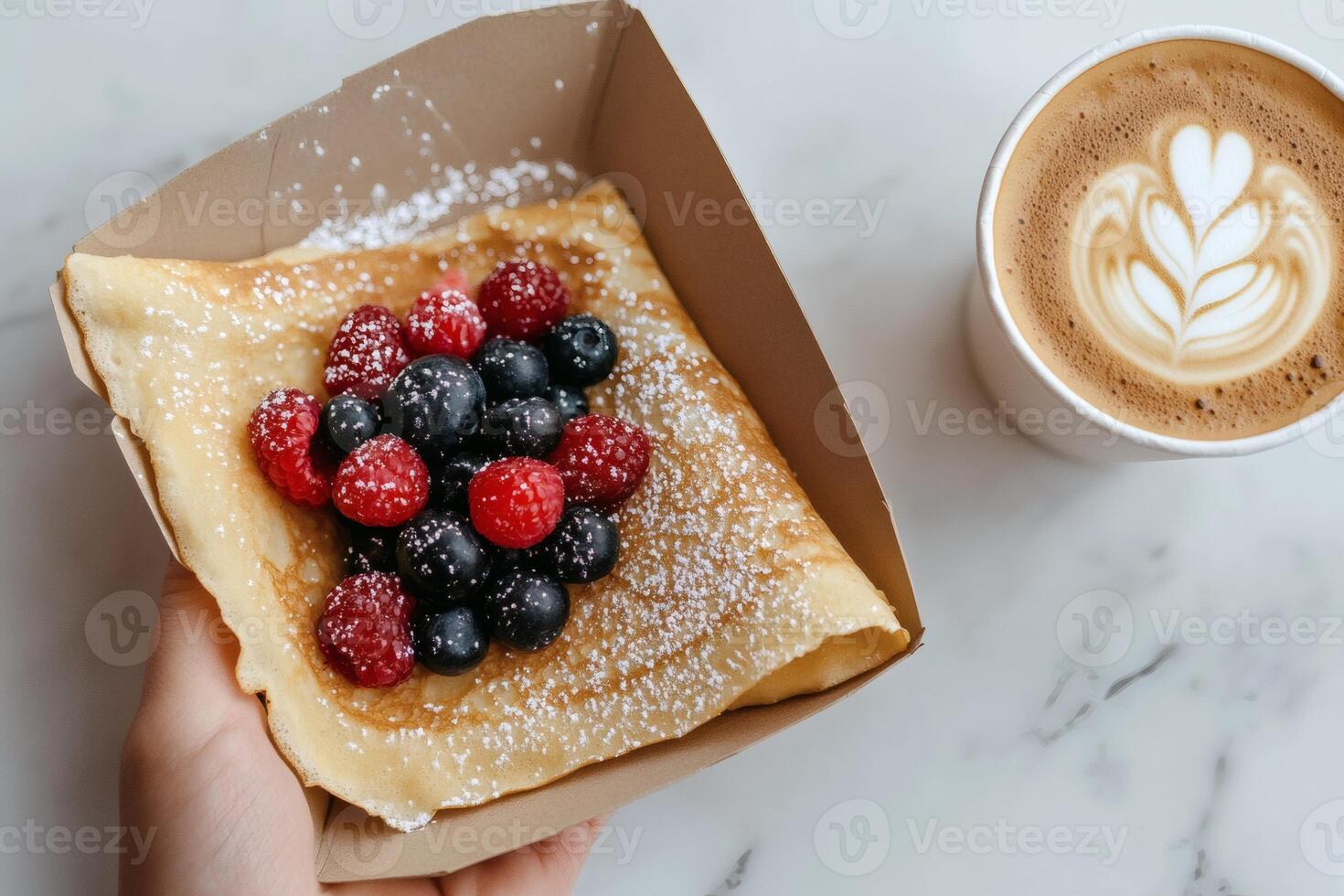 Delicious crepe topped with berries and coffee photo