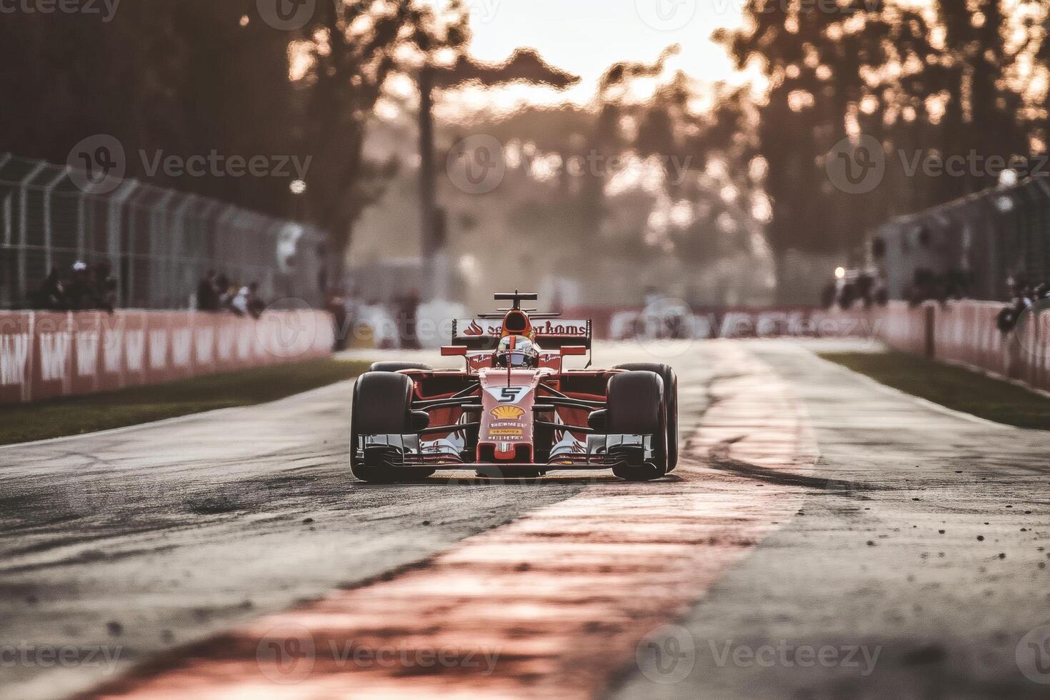 Formula One race car speeds through track during golden hour at a street circuit with vibrant sunset backdrop photo