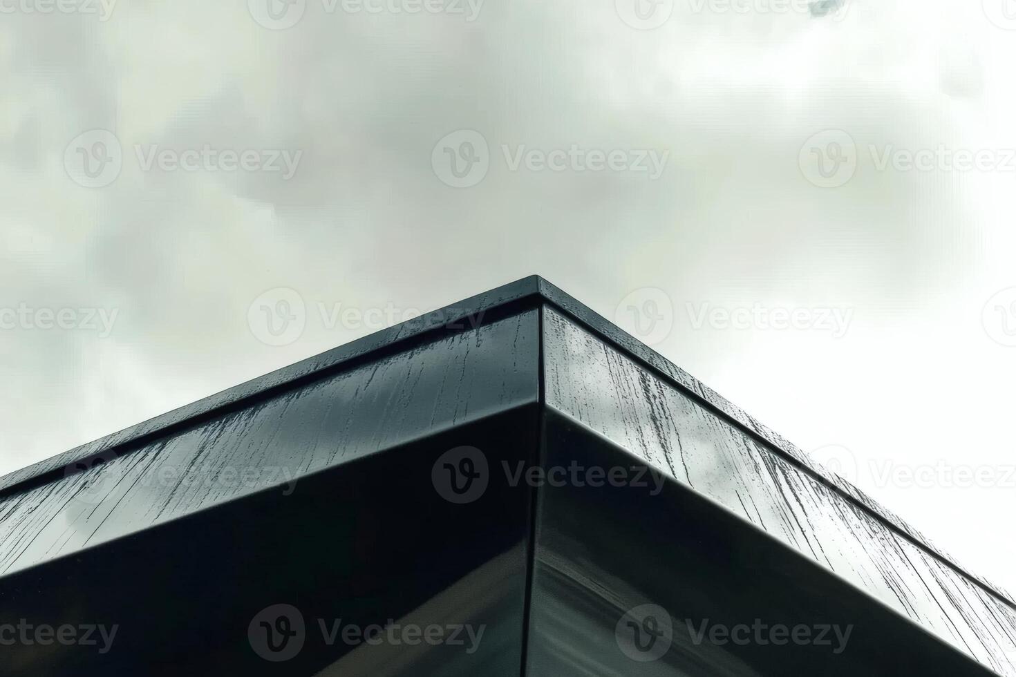 Unique architectural design showcases clean lines and modern aesthetics against a cloudy sky photo
