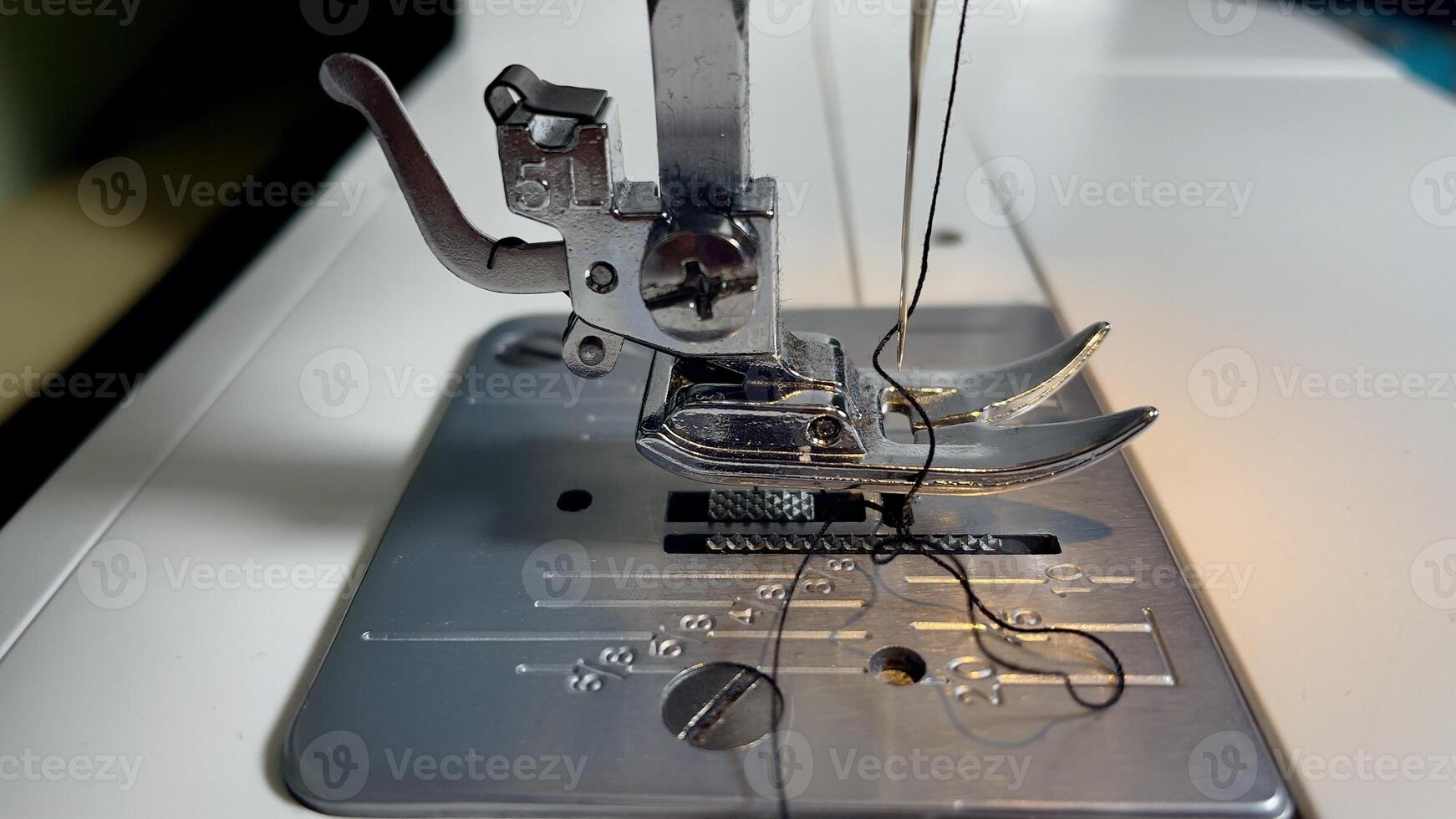 Sewing machine at work creating delicate fabric patterns photo