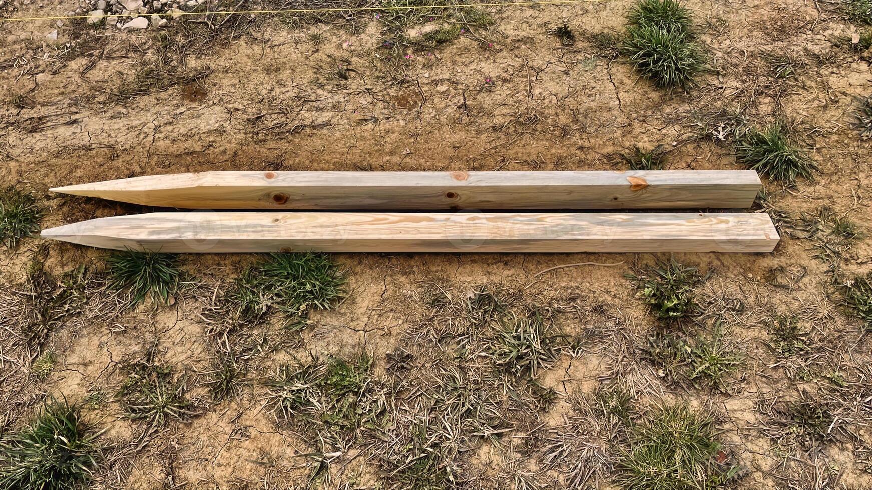 Constructive tools lie waiting on the ground near grass photo