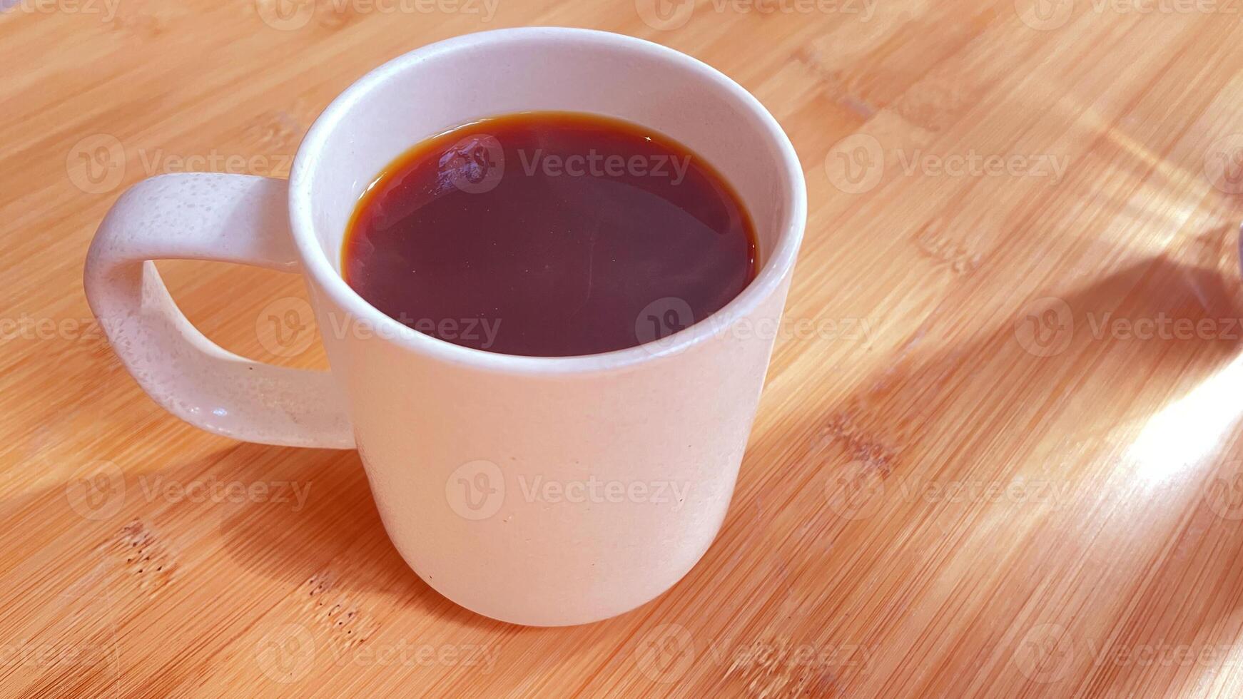 Warm earthy beverage enjoyed on a wooden table photo