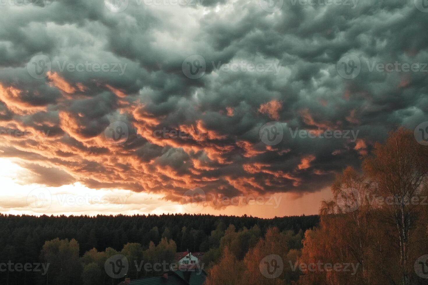 Dramatic clouds and sunset paint the sky. photo