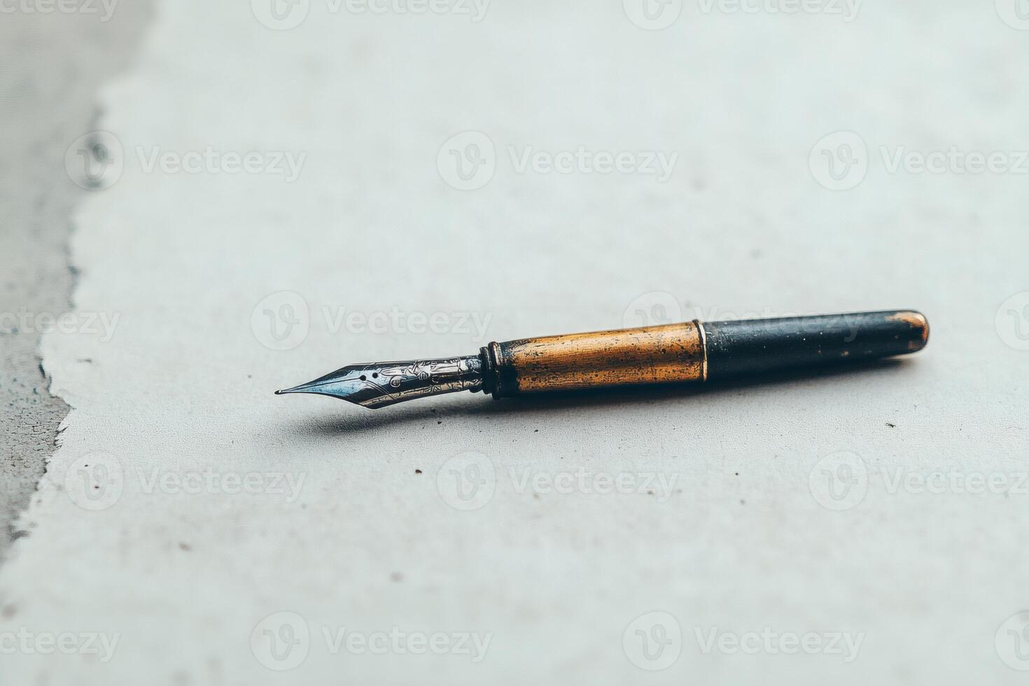 Elegant fountain pen rests on textured surface. photo