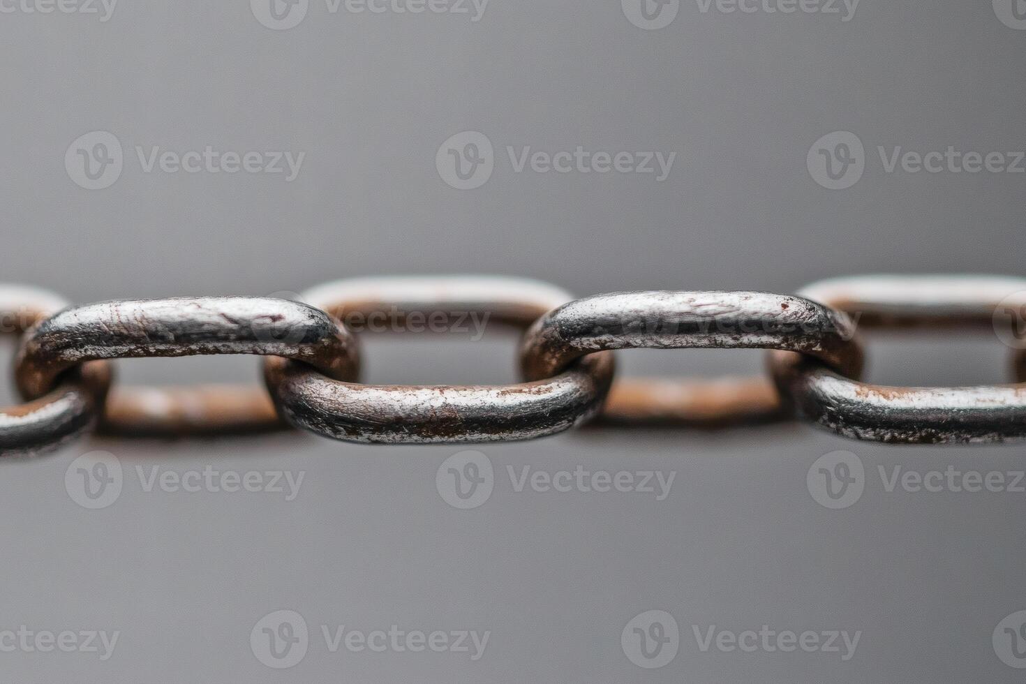 Metal chain links connecting in a close-up view of strength. photo