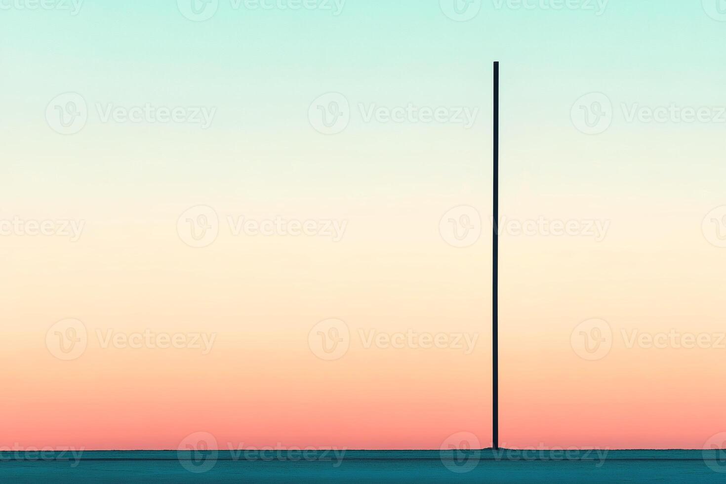 Solitary pole against a serene sunset sky. photo