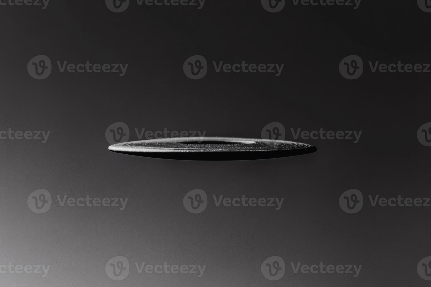 Floating record on a dark background showcases musical art. photo