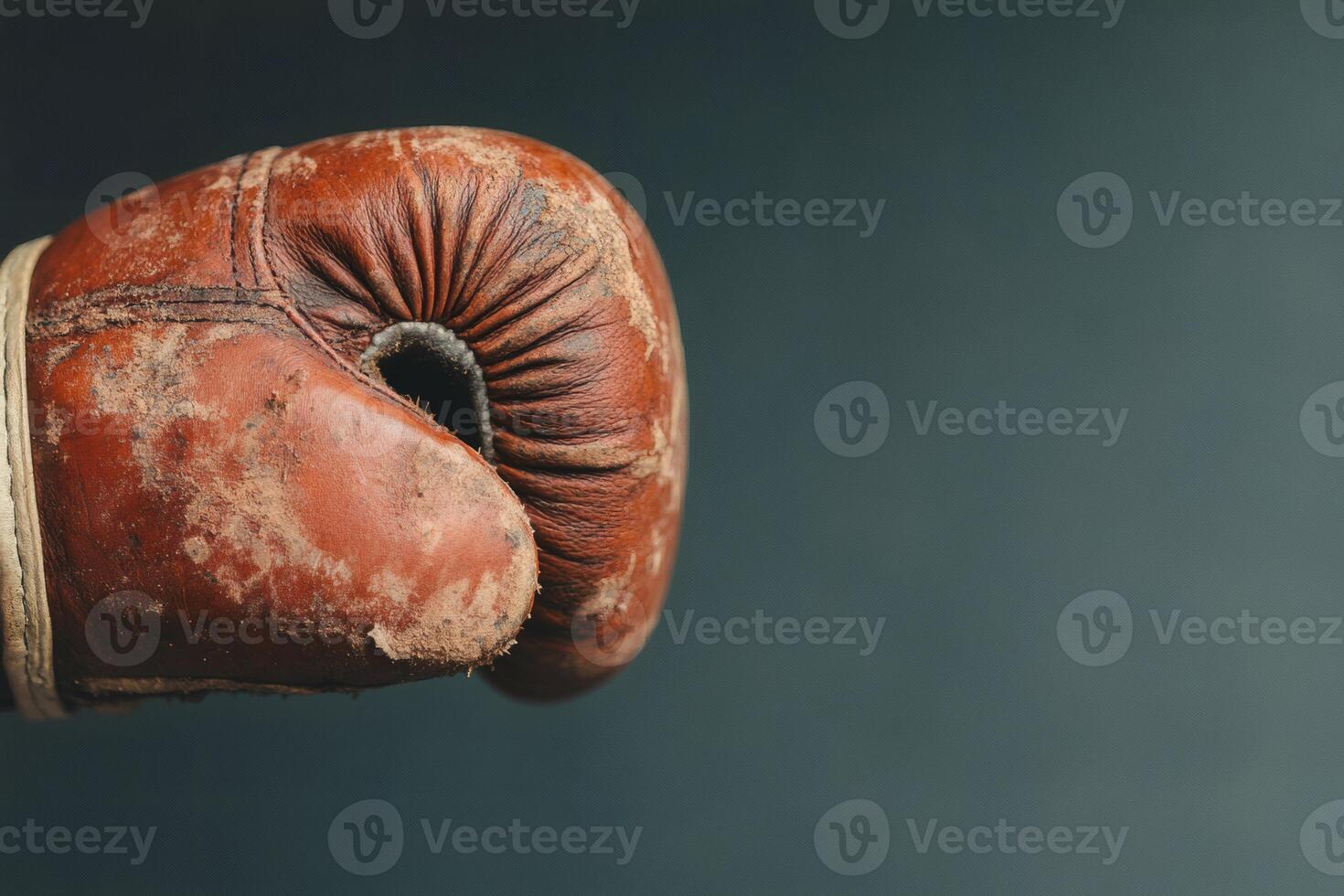 Weathered boxing glove ready for a fight. photo