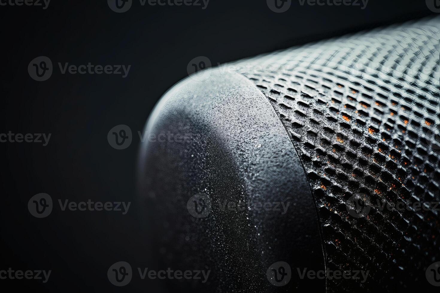 Textured surface of a modern speaker close-up view. photo