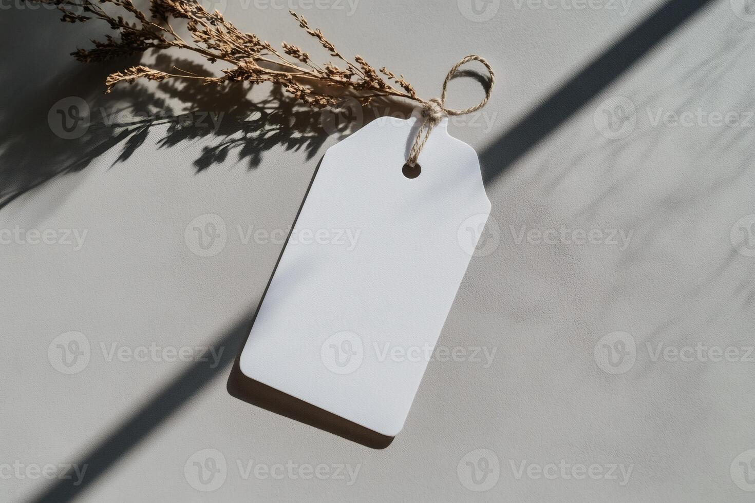 Blank tag illuminated by gentle sunlight on a table. photo